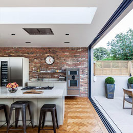 Fixed Rooflights | Herringbone wood floor and exposed brick kitchen