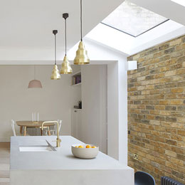 pitched skylight brick wall | EOS Rooflights Skylight system in pitched roof | minimal kitchen
