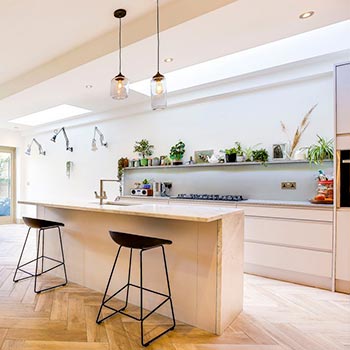 Bright white kitchen with 2 large roof lights