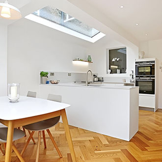 Long skylight in kitchen. Pitched rooflight system