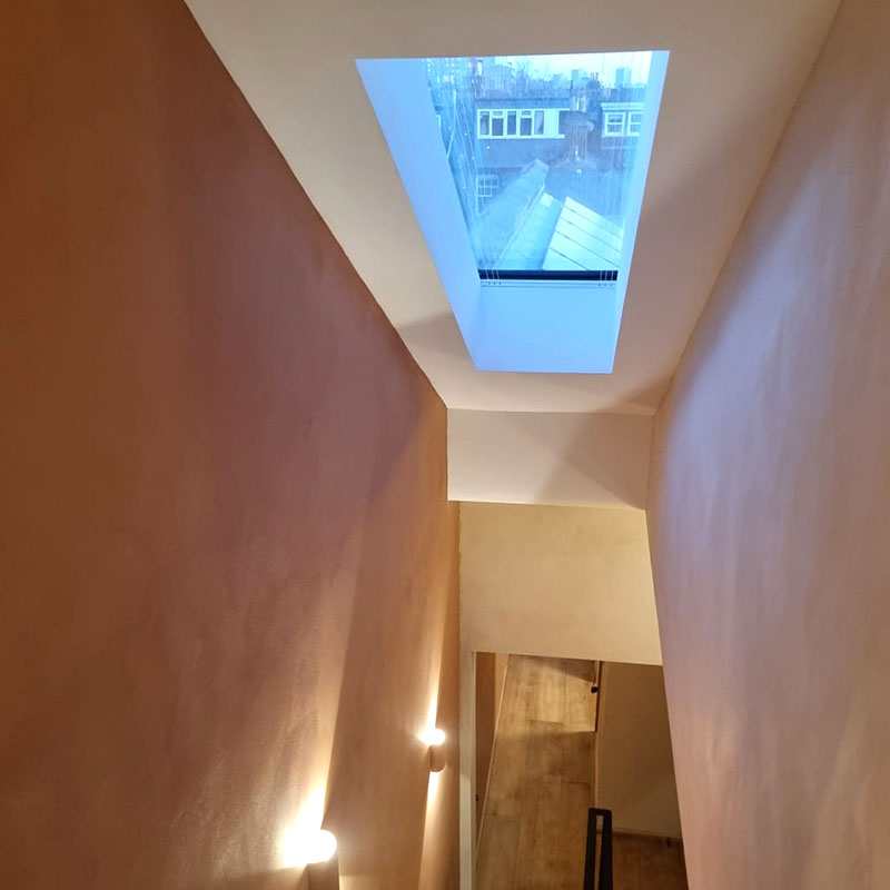 Pitched skylight with blind with textured plaster