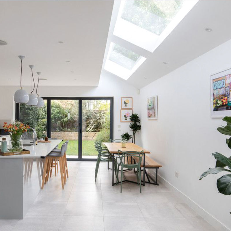 white kitchen with 2 large pitched skylight