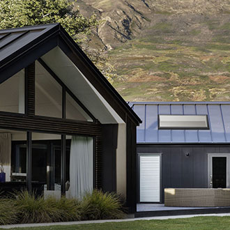 Landscape pitched skylight in metal seam roof