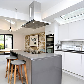 white kitchen with pitched skyligh | EOS Rooflights Skylight in pitched rooflight in kitchen extension